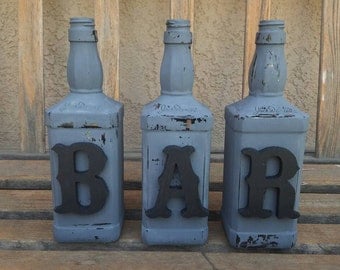 Decorated jack daniels bottles. Bar decor. Decorated bottles. Jack daniels decor