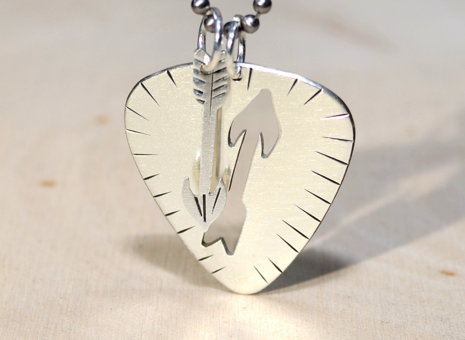 Sterling silver guitar pick necklace with handsawed arrow