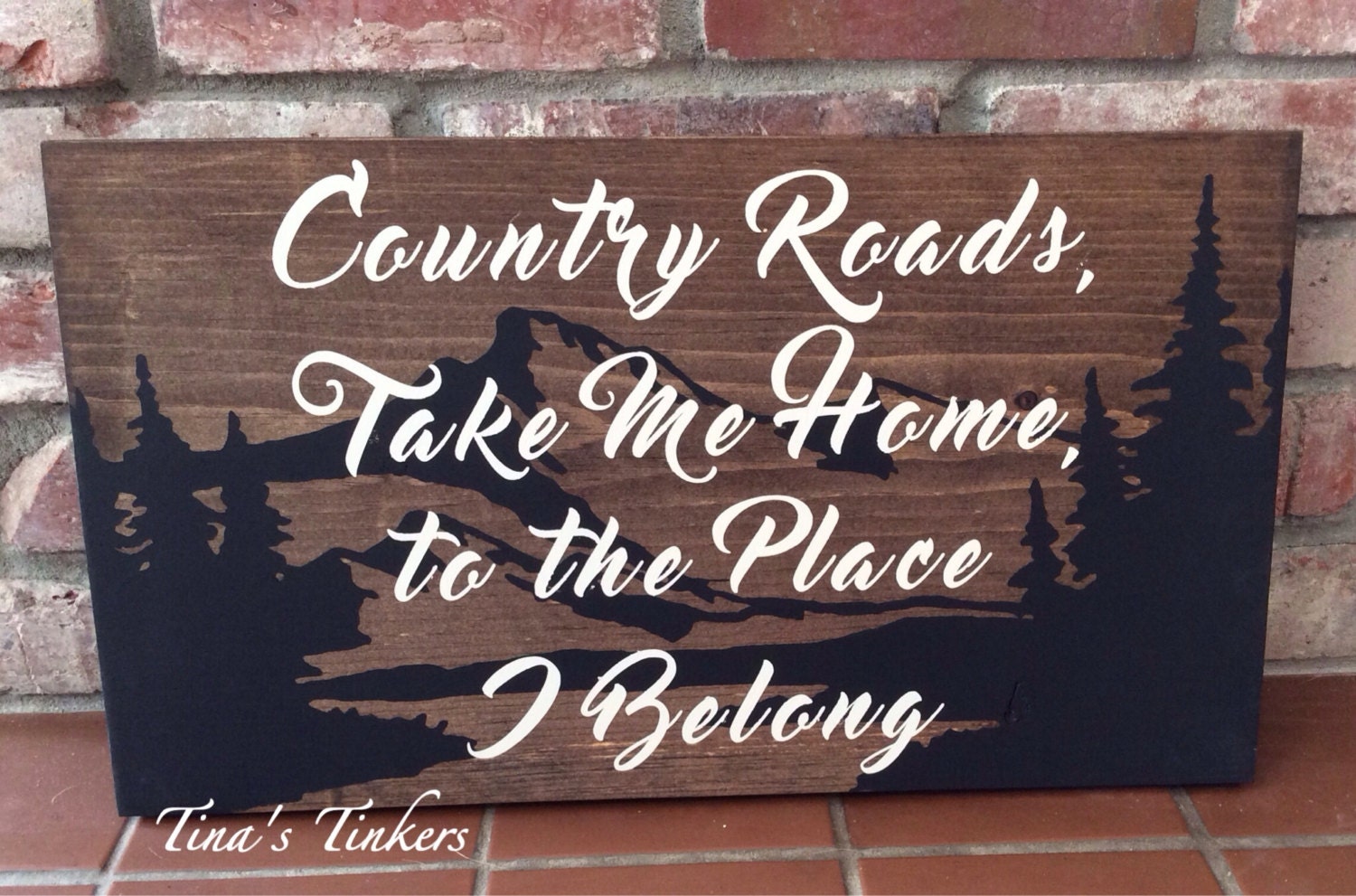 Country roads take me home to the place I belong. Painted wood