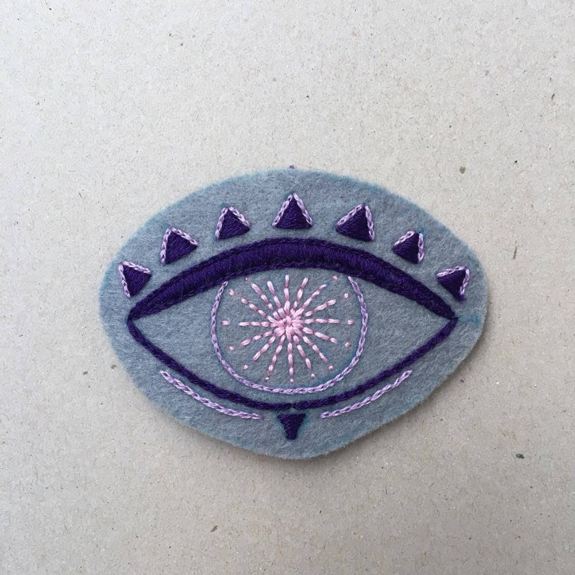 Detached hand embroidered eye patch