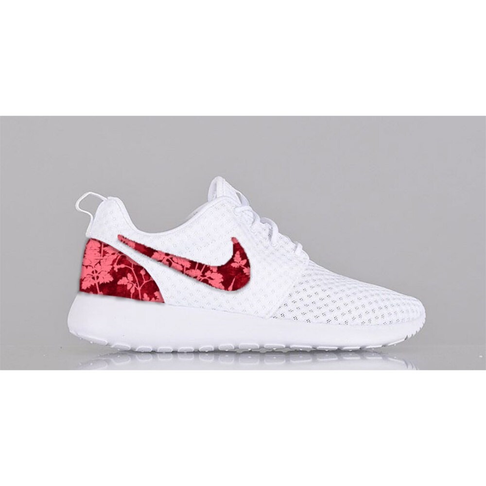 pink red and white nike shoes