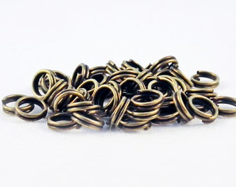 AJ08 - Rings double open Metal bronze 5mm / 5mm Bronze Metal Double Loop Open Jump Rings