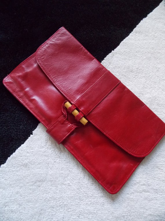 red leather clutch purse