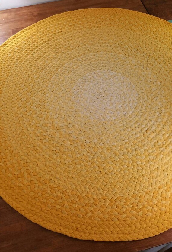 Deep yellow braided rug made from new cotton t shirt fabric