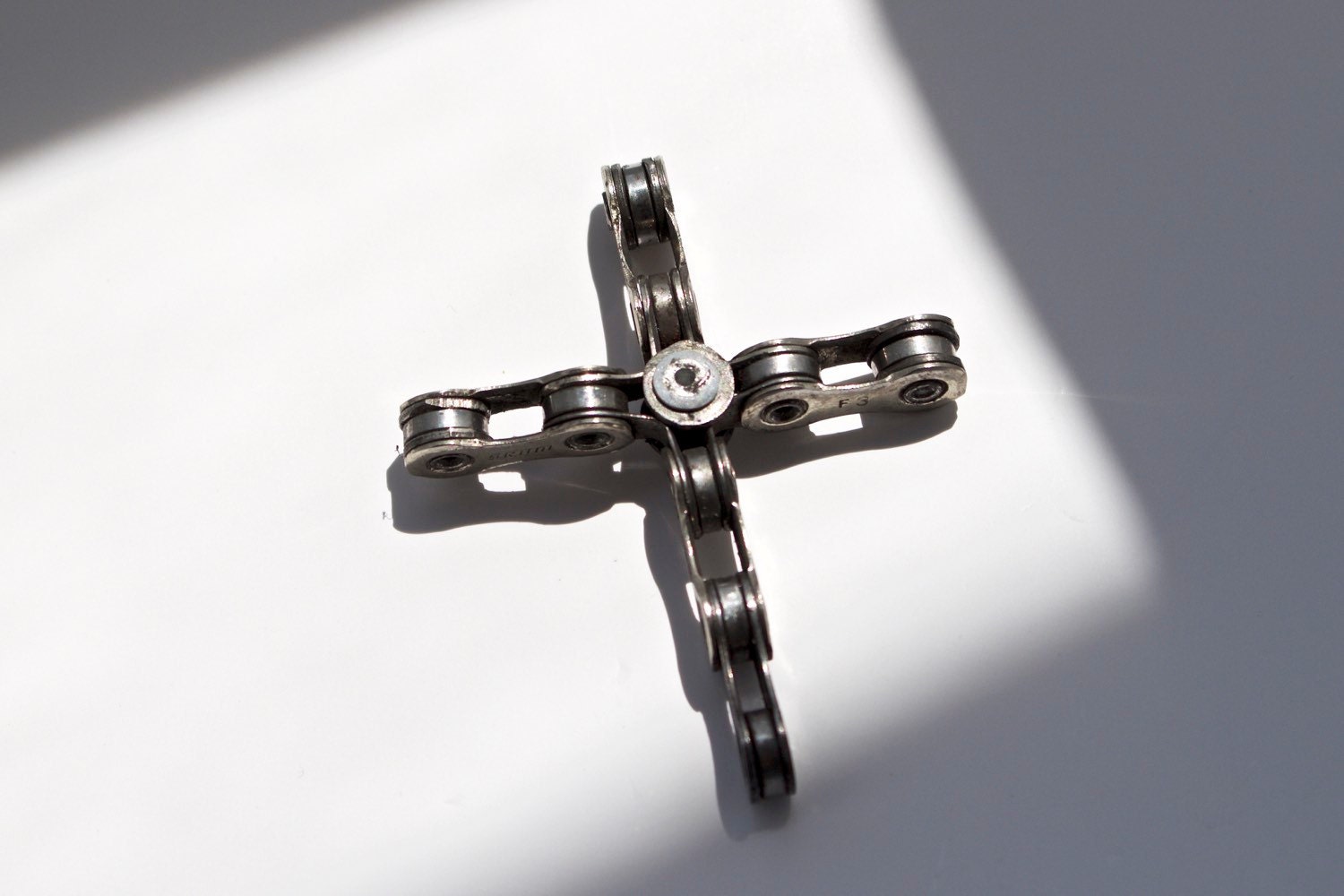 Bike chain cross pendant