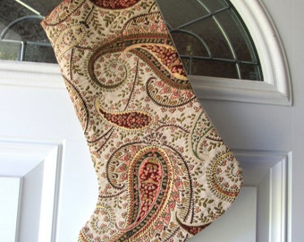 Christmas stockings in a paisley tapstry fabric with maroons, golds, greens, length 16 inches, 6 3/4 wide at top.