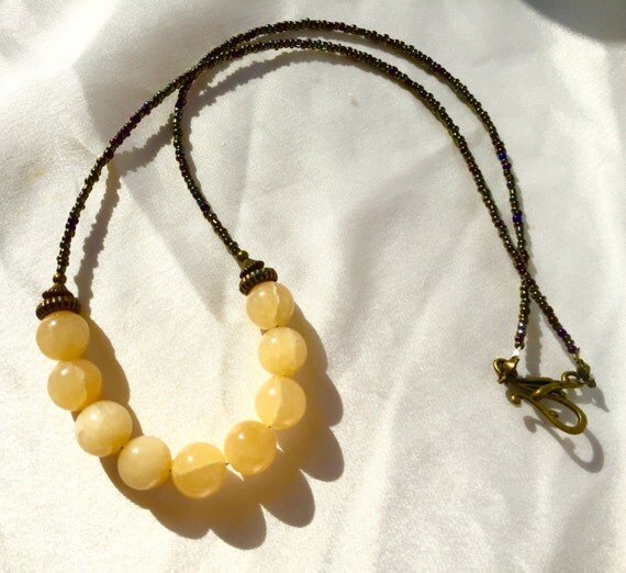 Items similar to Long, boho golden alabaster calcite necklace. Luminous