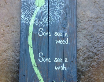 Dandelion art on weathered wood