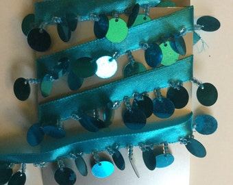 Turquoise ribbon, sequin and bead trim.