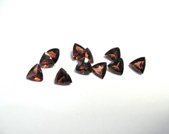 Mozambique garnet 5mm faceted trilliants. Choose how many you want. More you buy better the price.