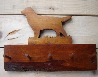 Door wood recycled leashes with Flat Coated Retriever