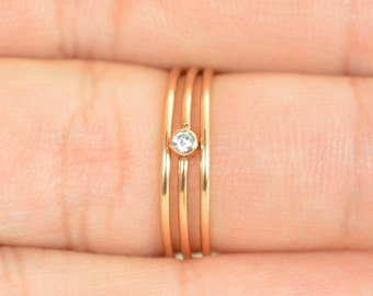 Items similar to Set of Seven Dainty Diamond Stacking Rings 14K Yellow