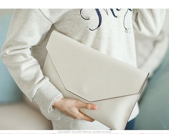 white leather envelope clutch bag