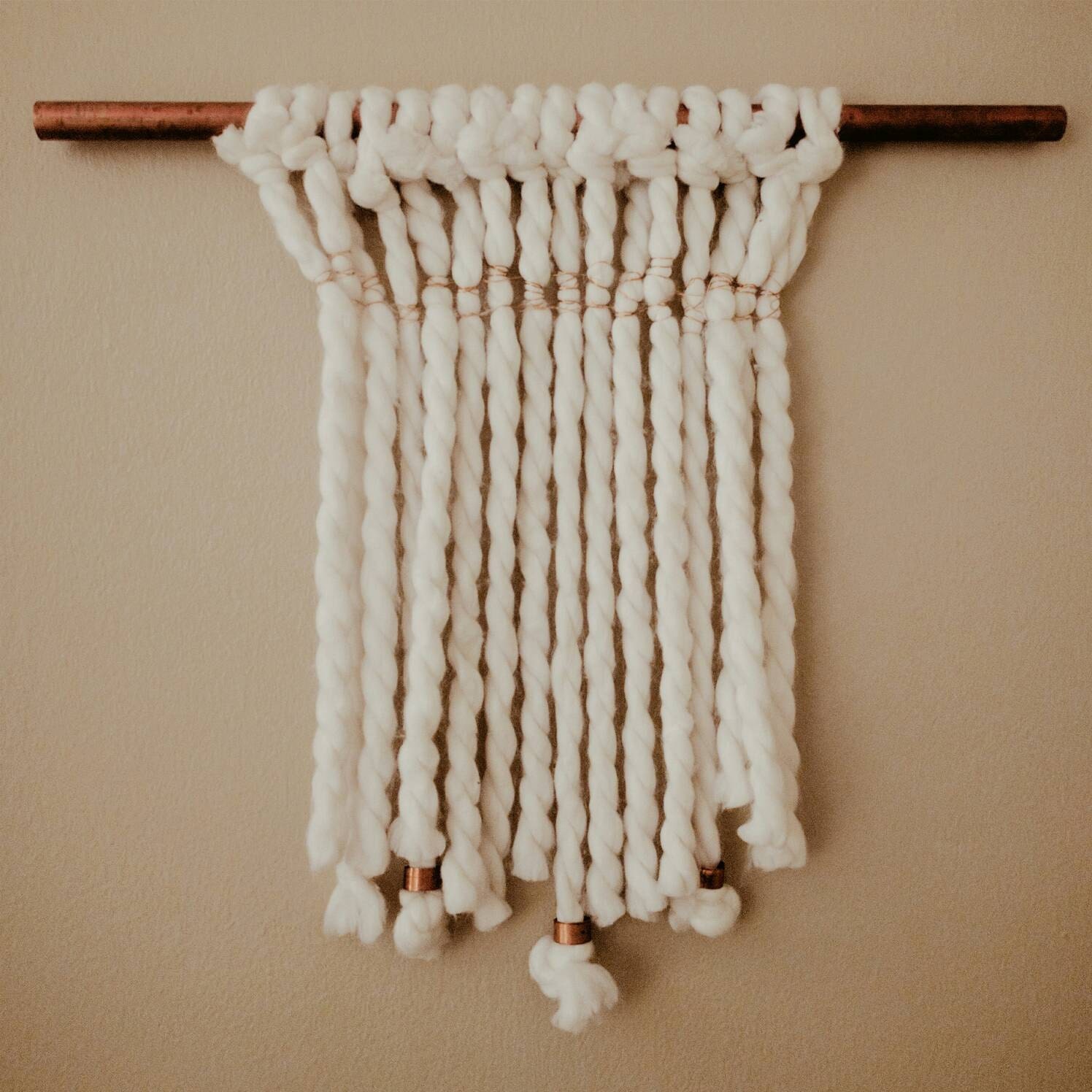 Copper and yarn woven wall hanging
