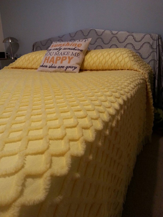 Vintage canary yellow twin sized chenille bedspread.