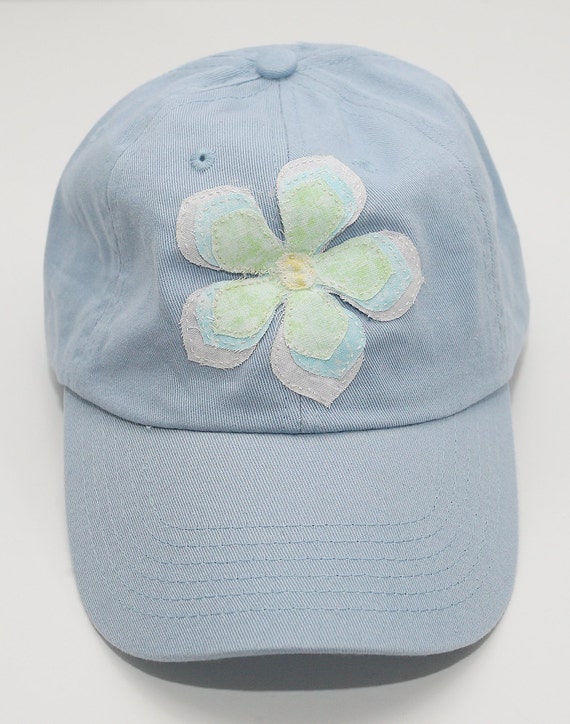 light blue fitted hat with pink brim