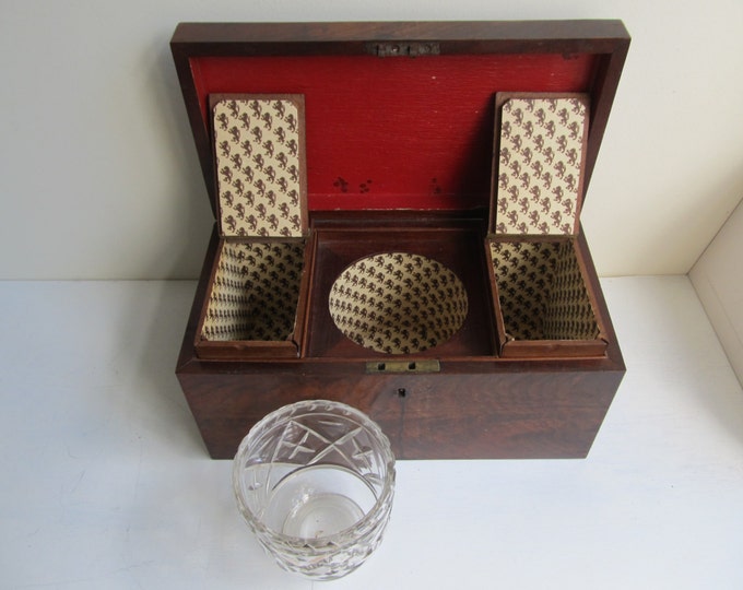 Antique Georgian Mahogany tea caddy with cut crystal mixing bowl. Re-lined interior with antique lion printed paper