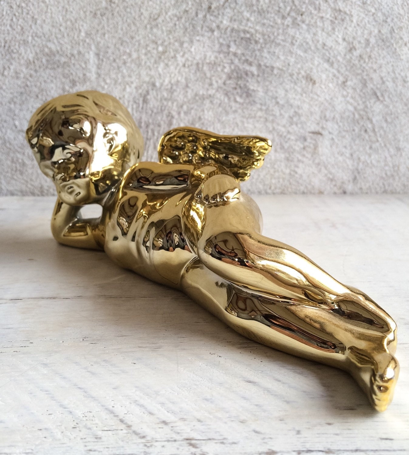 Pair of vintage shiny gold porcelain cherub statues shiny