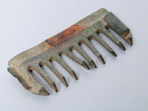 Antique metal comb. Rusty patina