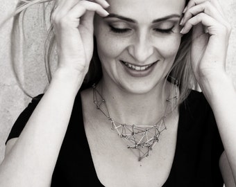 Geometric bib necklace Futuristika of stainless steel wire