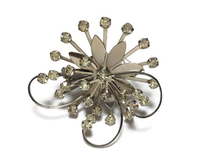 Rhinestone daisy brooch, clear rhinestones, silver tone flower, swirl pinwheel design, 1930s estimated age, faceted prong set