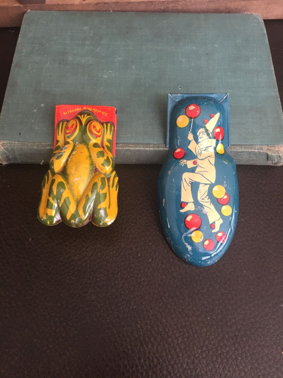 tin clicker toy