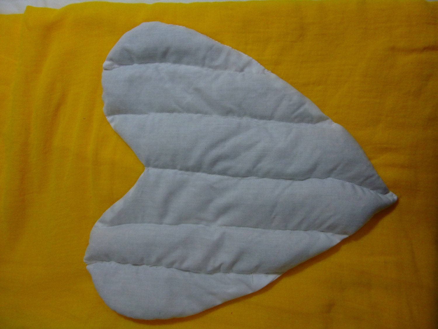 Wheatbag and fancy case. Heart shaped frilled with bag to