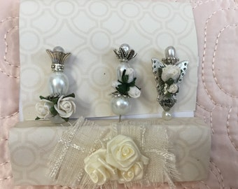 Decorative stick pins. With paper roses