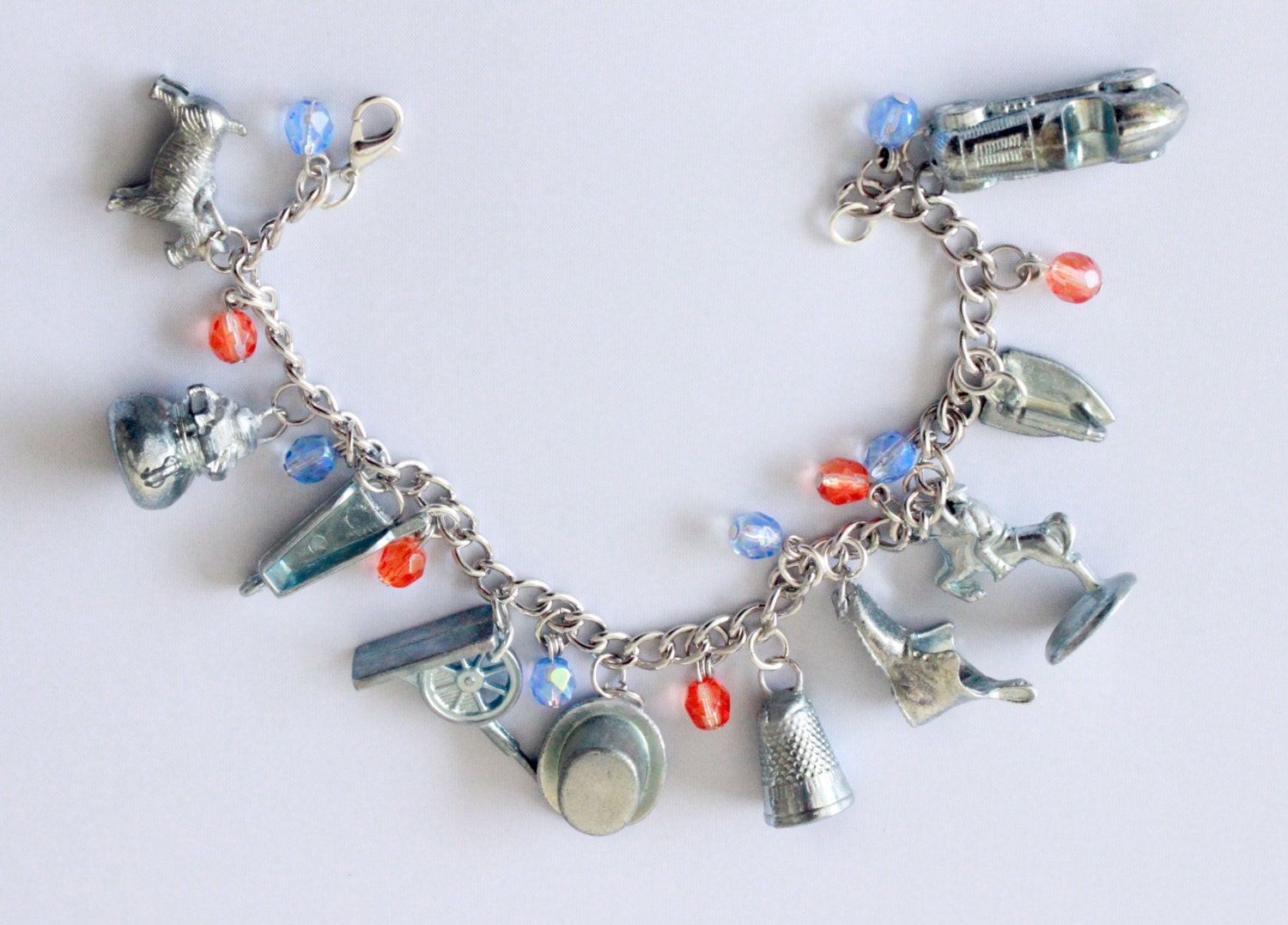 Monopoly Token Charm Bracelet with Light Blue and Orange Beads