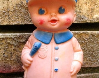 Sun Rubber Co. Police doll toy boy 1950s policeman blue soft squeeze toys dolls collectible baby teething midcentury molded unbreakable USA
