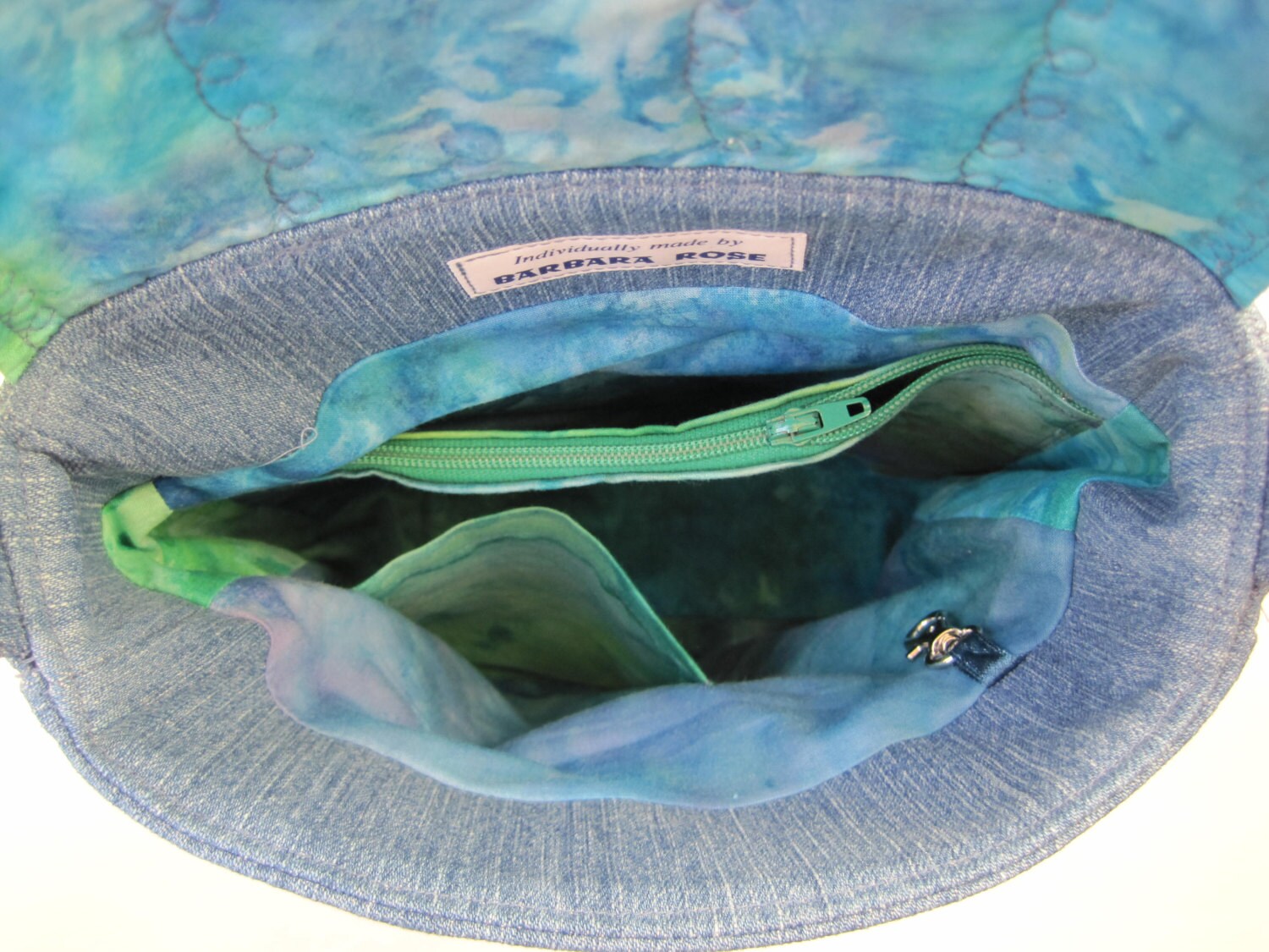 Blue denim crossbody bag made from upcycled fabric appliqued