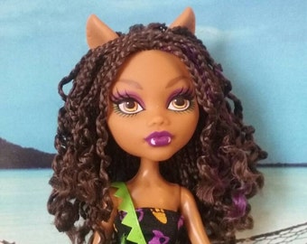 doll with curly brown hair