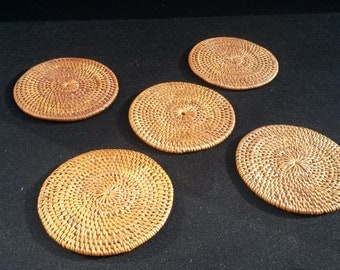 Set of 5 round hand woven wicker rattan coasters smoked over coconut