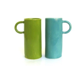 two colorful porcelain hand built cups. drinks for 2. demitasse. espresso.