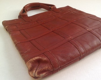 Leather satchel / 1970s retro leather purse / distressed leather handbag / top handles zipper closure / rust leather made in Columbia /