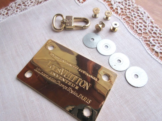 Authentic Metallic Plate by Louis Vuitton Original Logo