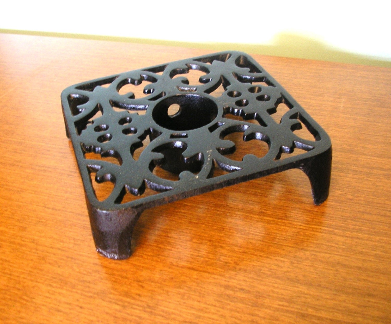 Vintage black cast iron trivet with tea light holder square