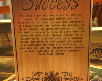 Success Poem by Ralph Waldo Emerson on a block of wood