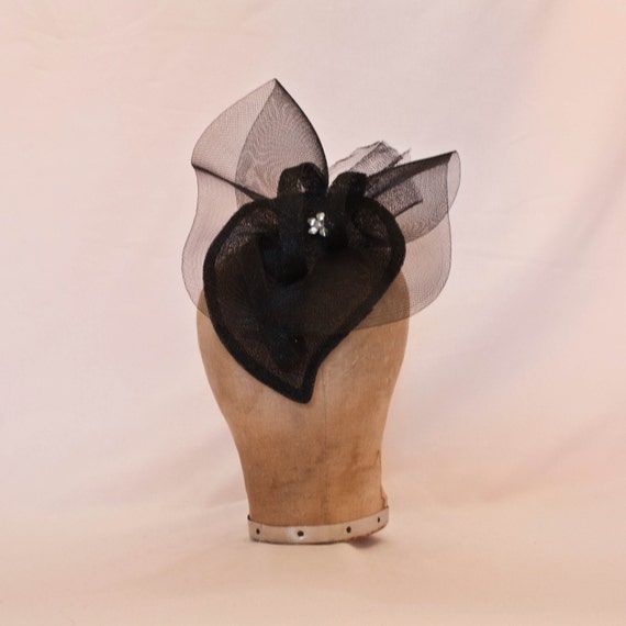 Handmade black heart shaped hat decorated with diamanté details