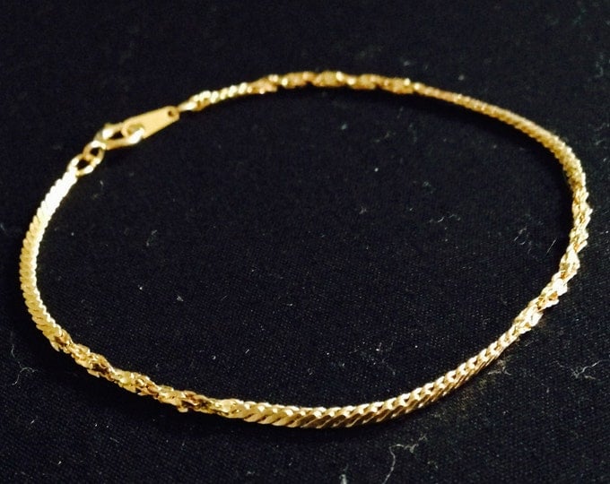 Storewide 25% Off SALE Vintage Gold Tone Alternating Braided Woven Designer Bracelet Featuring Fish Eye Clasp Closure Design