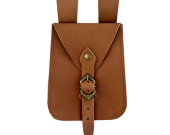 Leather belt bag with decorated metal buckle. For