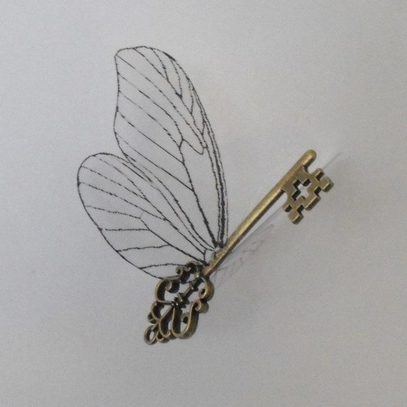 Key with large butterfly wings in antique brass harry potter