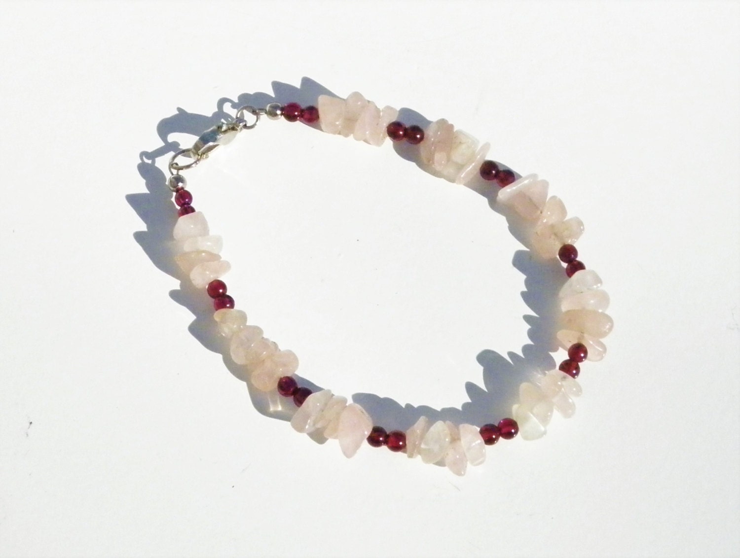 Garnet and Rose Quartz Gemstone Bracelet by snowflakeandchronos