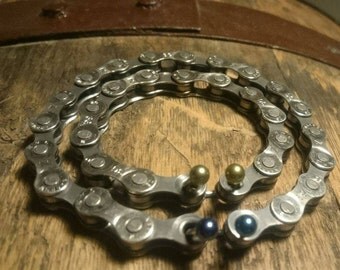Wristband made from a recycled bike chain