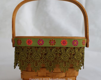 Small Longaberger basket with Venice lace and brocade ribbon