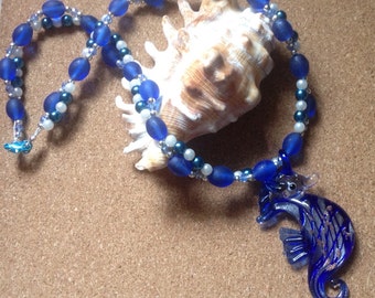 Stunning deep sea blue seahorse necklace