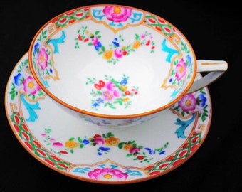 Minton china hand painted enamel art deco tea cup and saucer