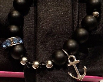Black beaded bracelet with Anchor Charm and Blue Rhinestone Charm