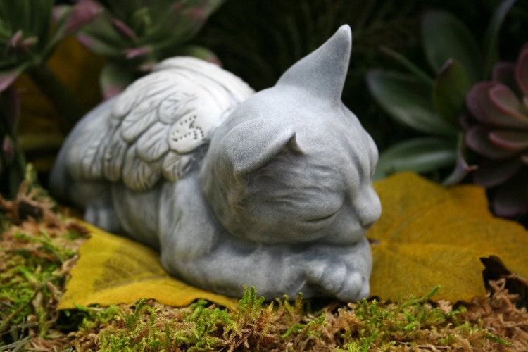 sleeping cat outdoor statue