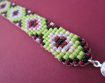 square stitch seed bead bracelet in green, red, pink and black